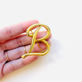 GOLD B BROOCH